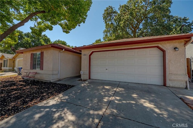 1584 Portola Way, Merced, CA 95348 - ranch-style house featuring concrete driveway, stucco siding, and a garage