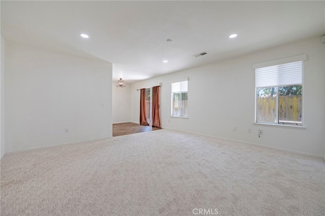 1584 Portola Way, Merced, CA 95348 - empty room featuring plenty of natural light, carpet floors, recessed lighting, and a chandelier
