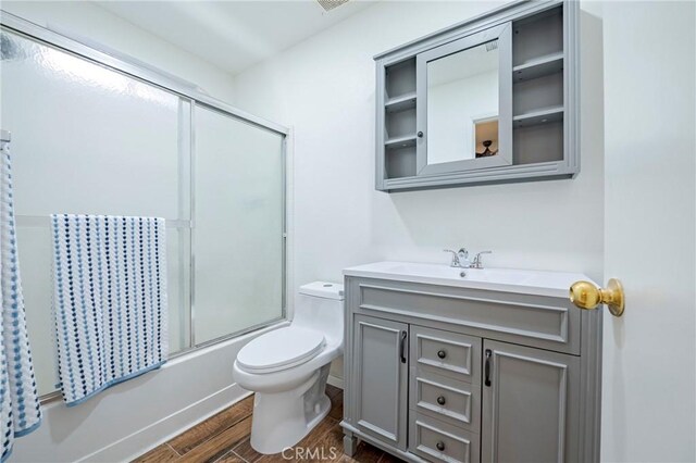 1584 Portola Way, Merced, CA 95348 - bathroom with wood finished floors, vanity, and combined bath / shower with glass door