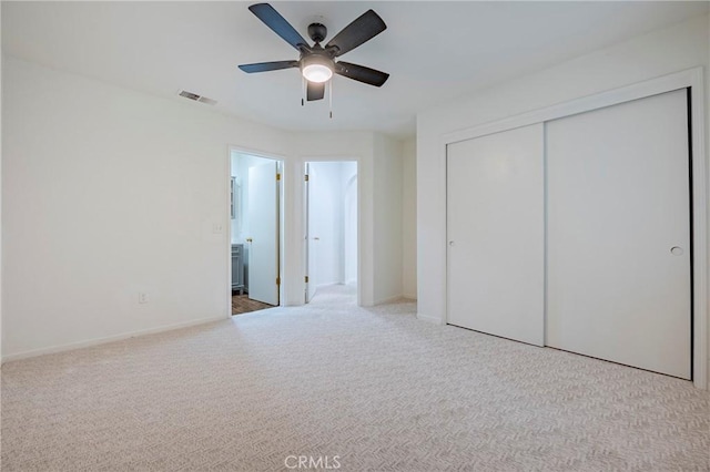 1584 Portola Way, Merced, CA 95348 - unfurnished bedroom featuring carpet floors, a closet, ceiling fan, and connected bathroom