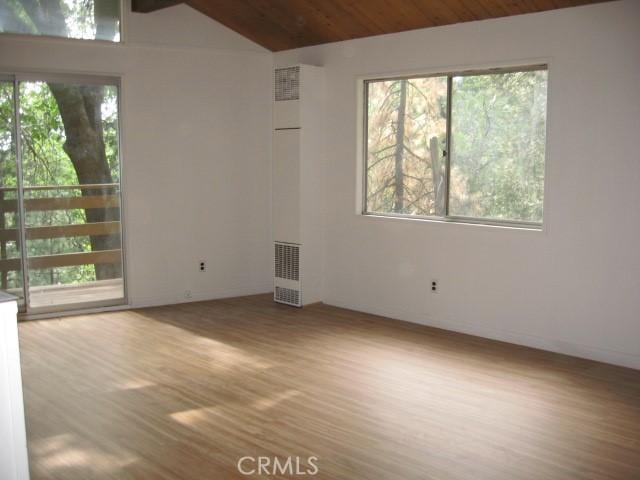 2756 Circle Dr, Running Springs, CA 92382 - spare room with wood finished floors and vaulted ceiling