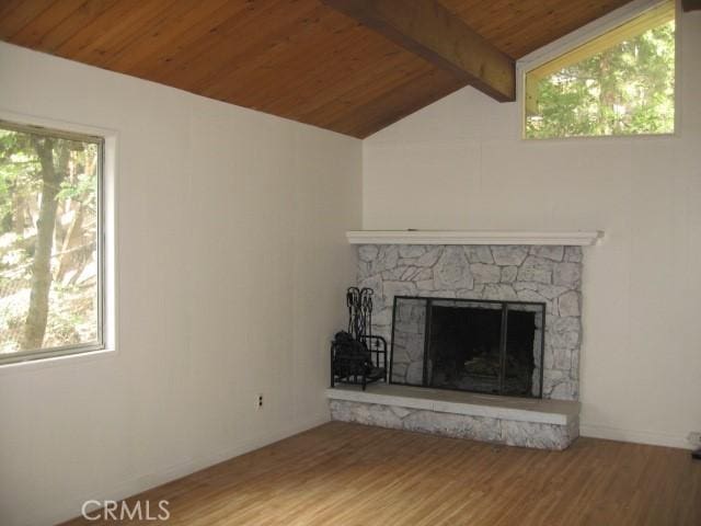 2756 Circle Dr, Running Springs, CA 92382 - unfurnished living room featuring wood ceiling, wood finished floors, healthy amount of natural light, and a stone fireplace