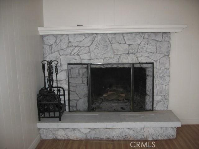 2756 Circle Dr, Running Springs, CA 92382 - detailed view of a fireplace and wood finished floors