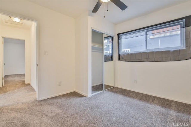 343 E 98th St, Los Angeles, CA 90003 - unfurnished bedroom with carpet, a closet, and ceiling fan