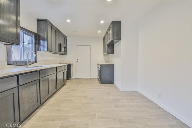 343 E 98th St, Los Angeles, CA 90003 - kitchen with recessed lighting, light countertops, and light wood-type flooring