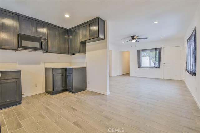 343 E 98th St, Los Angeles, CA 90003 - kitchen featuring black microwave, ceiling fan, recessed lighting, dark brown cabinets, and light countertops