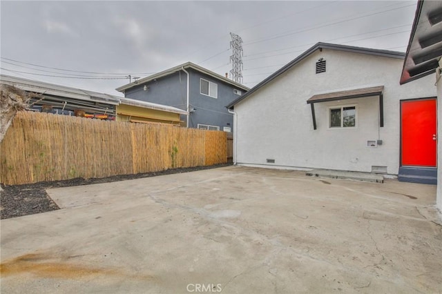 343 E 98th St, Los Angeles, CA 90003 - view of home's exterior with stucco siding and a patio