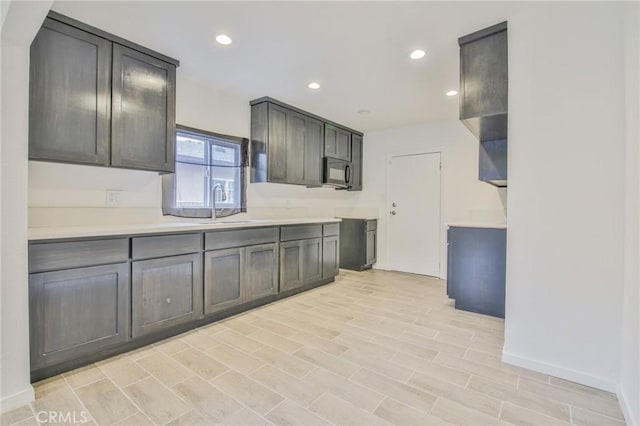 343 E 98th St, Los Angeles, CA 90003 - kitchen with black microwave, light countertops, and recessed lighting