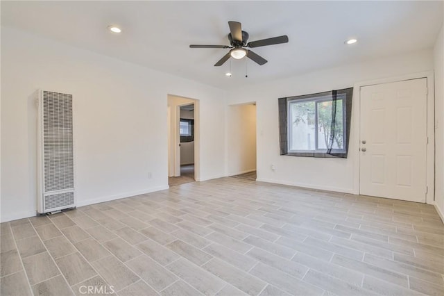 343 E 98th St, Los Angeles, CA 90003 - spare room with a heating unit, a ceiling fan, recessed lighting, and light wood finished floors