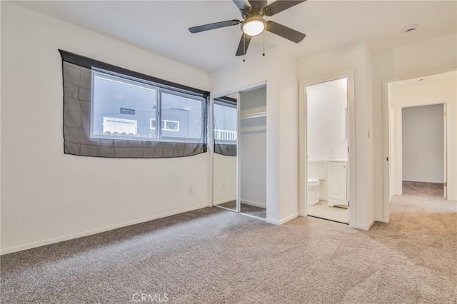 343 E 98th St, Los Angeles, CA 90003 - unfurnished bedroom featuring carpet floors, ensuite bath, a closet, and a ceiling fan