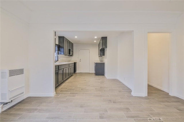 343 E 98th St, Los Angeles, CA 90003 - kitchen with heating unit, recessed lighting, light countertops, and light wood-style floors