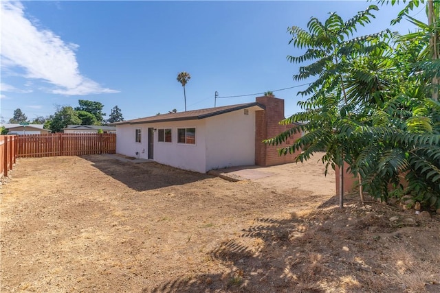 19436 Chaparral St, Rialto, CA 92376 - back of house with stucco siding and a fenced backyard