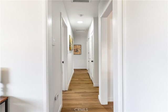 19436 Chaparral St, Rialto, CA 92376 - corridor featuring light wood finished floors and baseboards