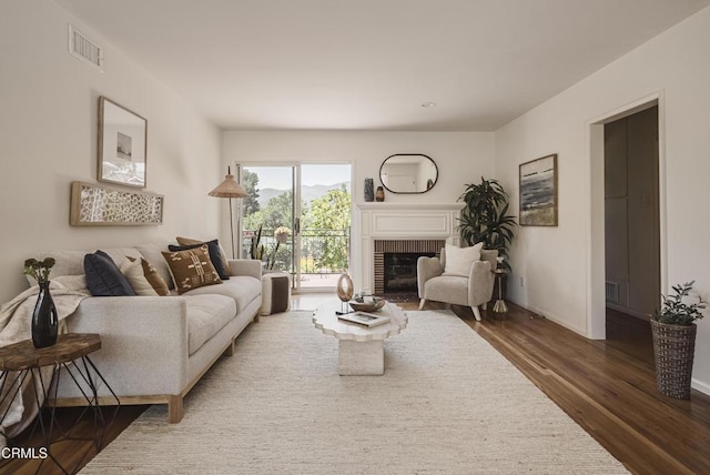 3254 Los Olivos Ln, La Crescenta, CA 91214 - living area with dark wood-style floors and a brick fireplace