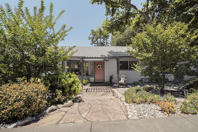 3254 Los Olivos Ln, La Crescenta, CA 91214 - view of property hidden behind natural elements featuring roof with shingles