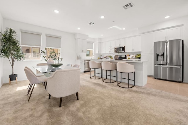 2310 Stardust Gln, Escondido, CA 92025 - dining space with light colored carpet and recessed lighting