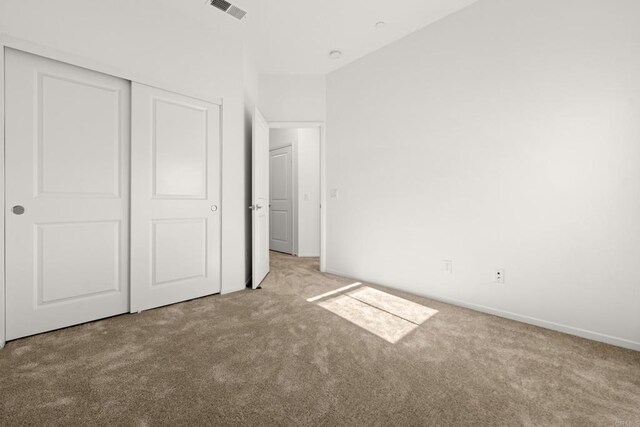 2310 Stardust Gln, Escondido, CA 92025 - unfurnished bedroom featuring carpet and a closet