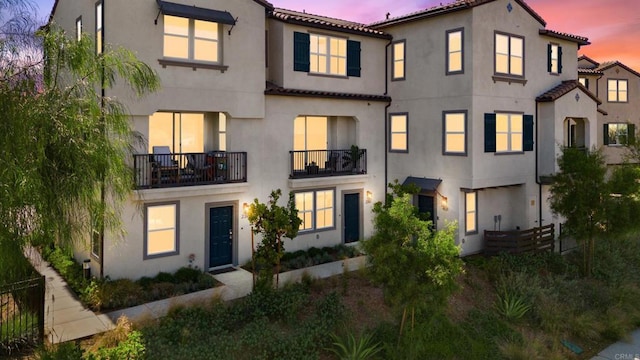 2310 Stardust Gln, Escondido, CA 92025 - view of front of home featuring stucco siding, a tile roof, and a balcony