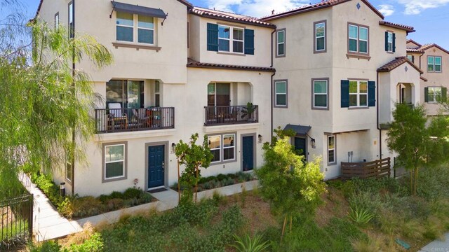 2310 Stardust Gln, Escondido, CA 92025 - view of front of house with stucco siding and a tiled roof