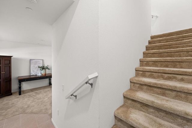 2310 Stardust Gln, Escondido, CA 92025 - staircase featuring carpet and tile patterned floors