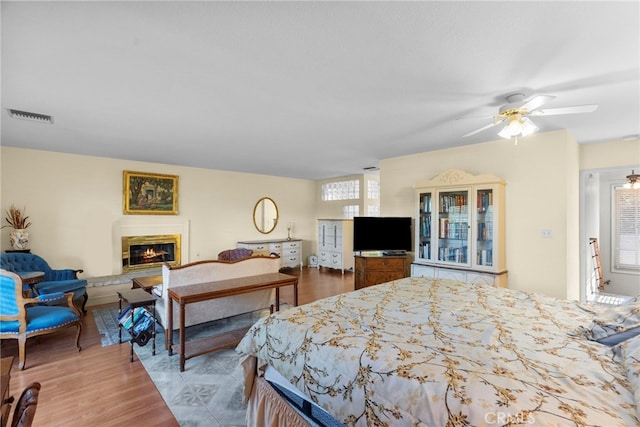 4790 Adam Rd, Simi Valley, CA 93063 - bedroom with a glass covered fireplace and wood finished floors