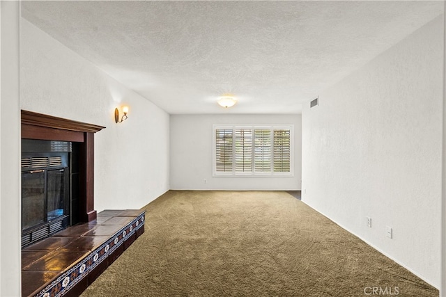 4790 Adam Rd, Simi Valley, CA 93063 - unfurnished living room featuring carpet floors, a tiled fireplace, and a textured ceiling