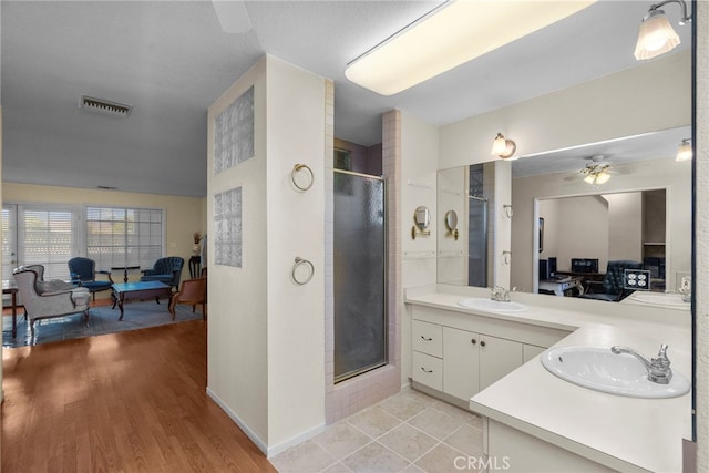 4790 Adam Rd, Simi Valley, CA 93063 - full bathroom featuring connected bathroom, a stall shower, vanity, wood finished floors, and a ceiling fan