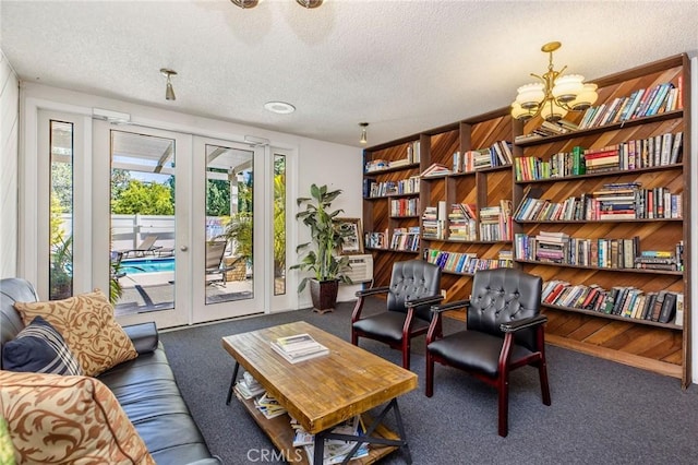 14315 Riverside Dr Unit 209, Sherman Oaks, CA 91423 - living area featuring a textured ceiling, carpet, french doors, and a chandelier