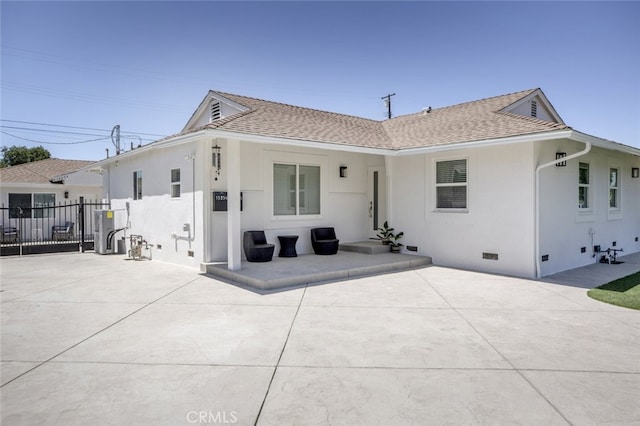 15256 Clymer St, San Fernando, CA 91345 - back of house with crawl space, stucco siding, a patio area, and a shingled roof
