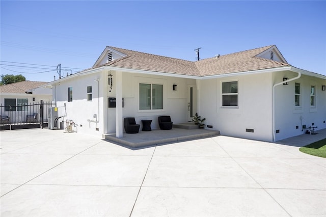15256 Clymer St, San Fernando, CA 91345 - back of property featuring crawl space, stucco siding, a patio, and a shingled roof
