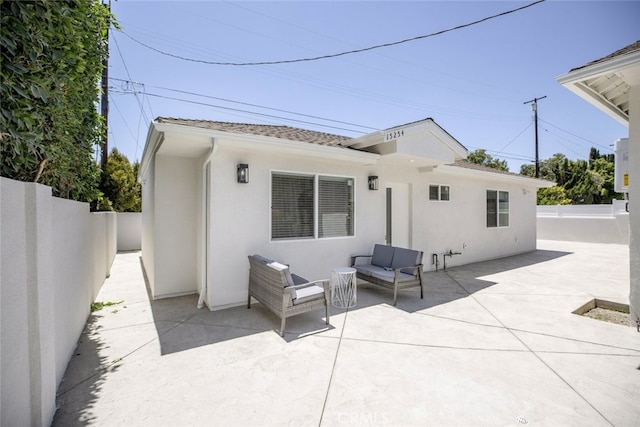 15256 Clymer St, San Fernando, CA 91345 - back of house featuring a patio area and stucco siding