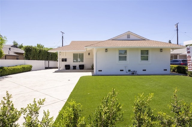 15256 Clymer St, San Fernando, CA 91345 - rear view of property featuring a patio area, stucco siding, and driveway