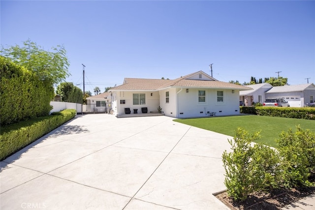 15256 Clymer St, San Fernando, CA 91345 - view of front of house featuring driveway, a patio, and stucco siding