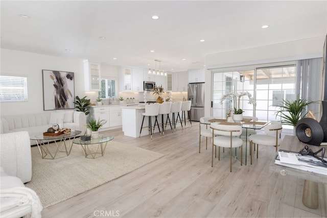15256 Clymer St, San Fernando, CA 91345 - dining area with light wood-type flooring and recessed lighting