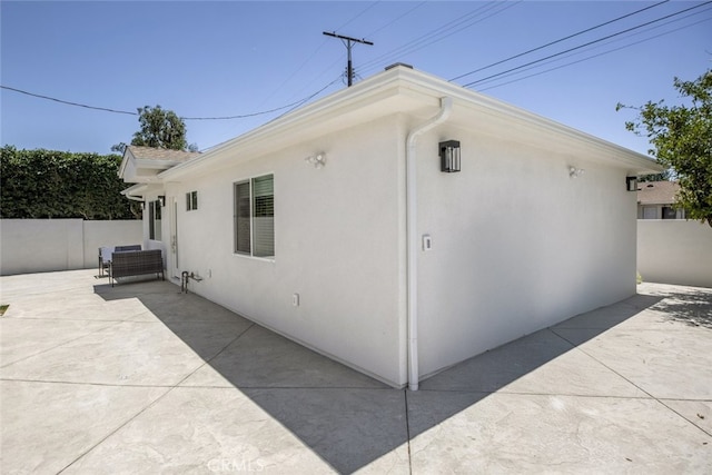 15256 Clymer St, San Fernando, CA 91345 - view of property exterior with a patio and stucco siding