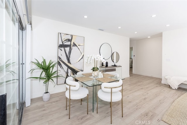 15256 Clymer St, San Fernando, CA 91345 - dining area featuring light wood-style flooring and recessed lighting
