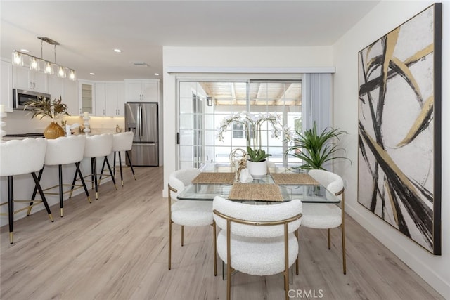 15256 Clymer St, San Fernando, CA 91345 - dining area with light wood-style floors and recessed lighting