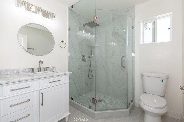 15256 Clymer St, San Fernando, CA 91345 - full bathroom featuring vanity, a marble finish shower, and tile patterned floors