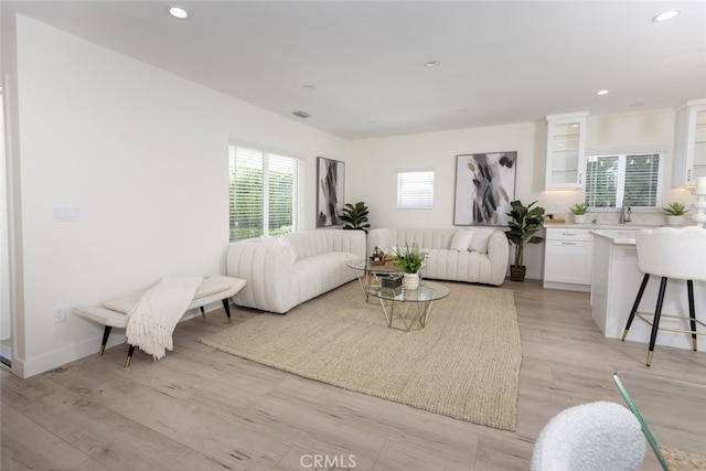 15256 Clymer St, San Fernando, CA 91345 - living room with recessed lighting and light wood-type flooring