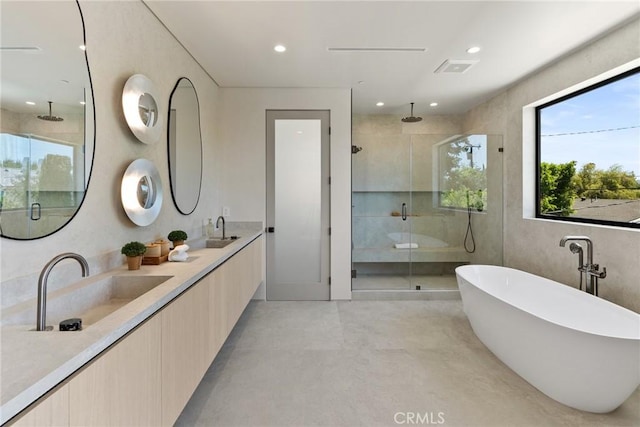 14738 Otsego St, Sherman Oaks, CA 91403 - bathroom with a shower stall, finished concrete flooring, double vanity, a freestanding tub, and recessed lighting