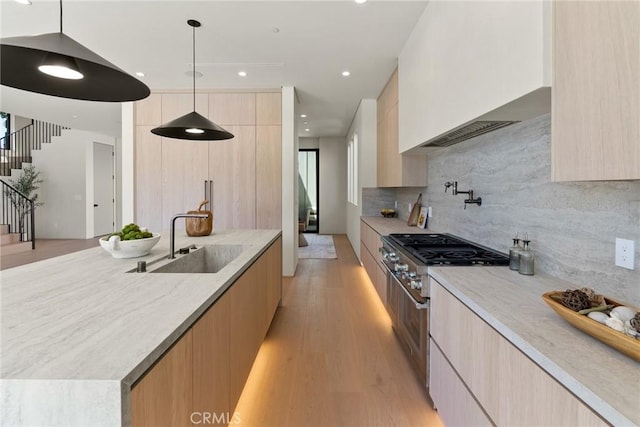 14738 Otsego St, Sherman Oaks, CA 91403 - kitchen with modern cabinets, high end stainless steel range, light brown cabinetry, and recessed lighting
