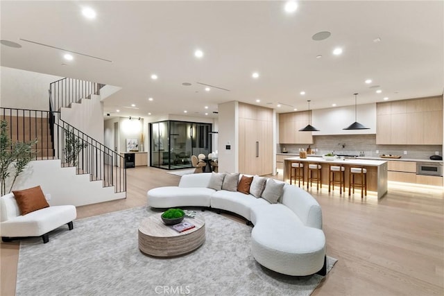14738 Otsego St, Sherman Oaks, CA 91403 - living area featuring recessed lighting, stairway, and light wood-type flooring
