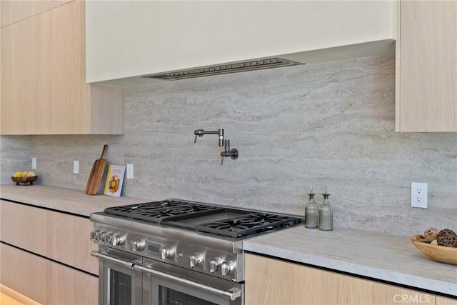 14738 Otsego St, Sherman Oaks, CA 91403 - kitchen with range with two ovens, light brown cabinetry, and modern cabinets