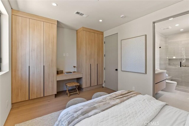 14738 Otsego St, Sherman Oaks, CA 91403 - bedroom with wood finished floors, recessed lighting, and connected bathroom