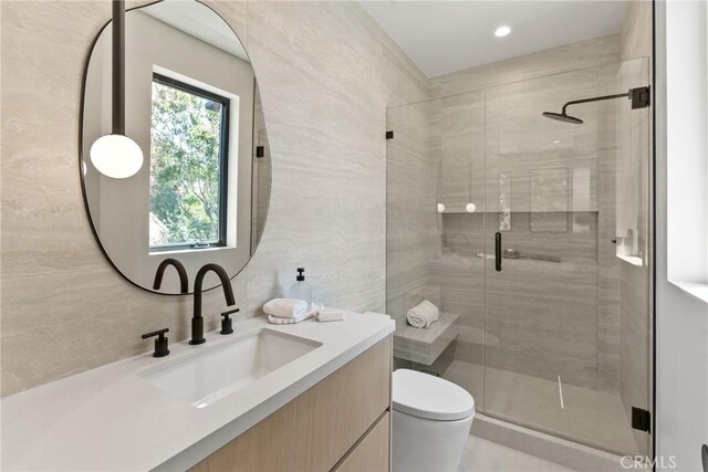 14738 Otsego St, Sherman Oaks, CA 91403 - full bathroom featuring vanity, a shower stall, and tile walls