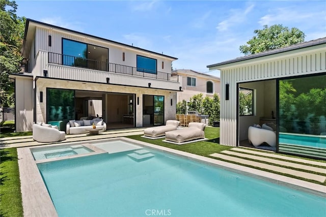 14738 Otsego St, Sherman Oaks, CA 91403 - rear view of property with a balcony, an outdoor living space, a patio, and a pool with connected hot tub