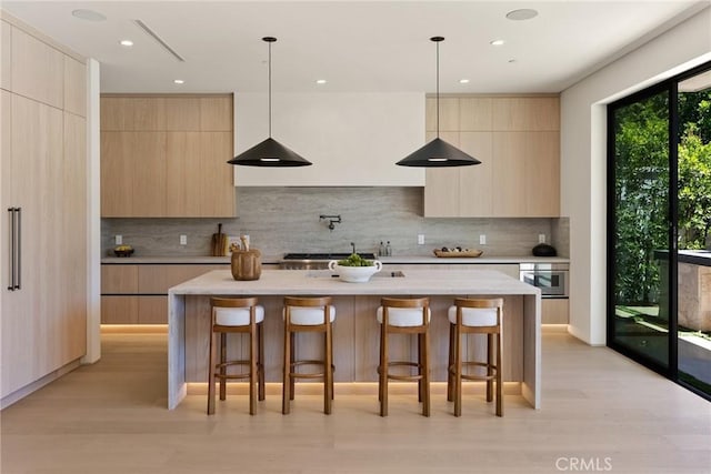 14738 Otsego St, Sherman Oaks, CA 91403 - kitchen with modern cabinets, light brown cabinetry, tasteful backsplash, light countertops, and recessed lighting