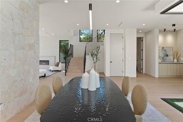 14738 Otsego St, Sherman Oaks, CA 91403 - dining area with stairs, recessed lighting, wood finished floors, and a glass covered fireplace
