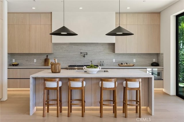 14738 Otsego St, Sherman Oaks, CA 91403 - kitchen featuring modern cabinets, light brown cabinetry, decorative backsplash, and recessed lighting