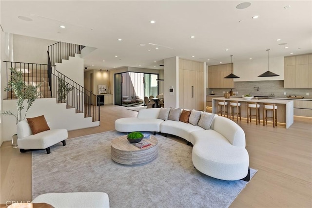 14738 Otsego St, Sherman Oaks, CA 91403 - living room with light wood-style floors, recessed lighting, and stairway